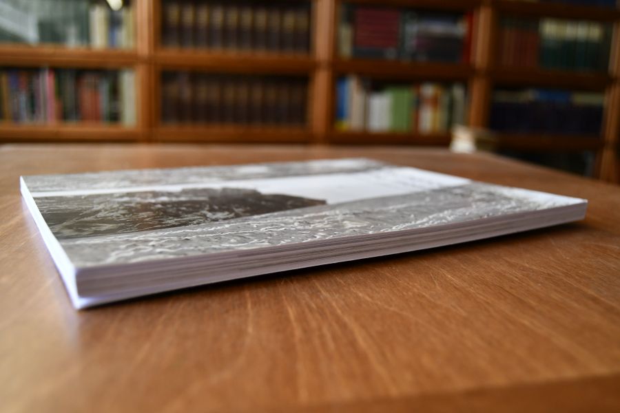 Zwischenzeitlich = In the meantime.